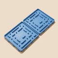 Paleta Mats freezable lick mat 2-pack in Cool Blue on a clean sand studio background